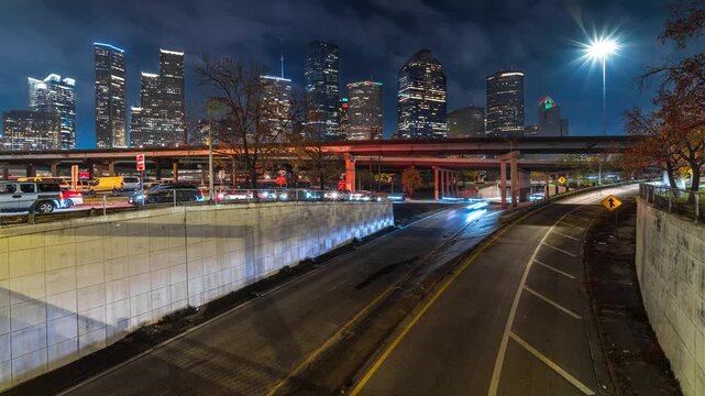 time lapse of Houston highway transportation with skyline modern business building in Houston downtown after business hour, business highway to office in Houston Downtown, Texas, United states, USA
