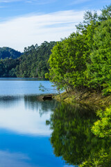 Tranquil Landscape with reflective waters of the Z&ecirc;zere River in Central Portugal in the river beach of Alqueidao - Tomar