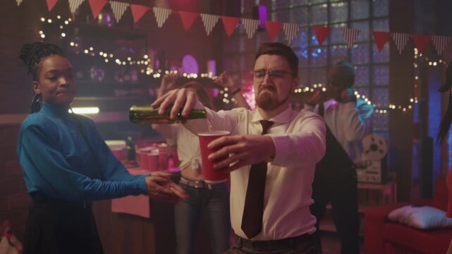 Office party spills everywhere, Guests at office party stumble and laugh amidst scattered drinks and cheerful chaos