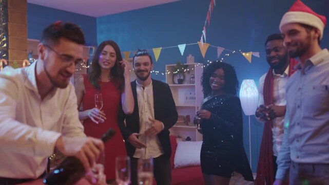 Colleagues celebrate holiday cheer together, Holiday party with coworkers sharing joyful moments and hearty toasts