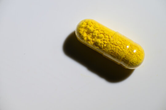 Close up of Berberine Supplement Capsule on White Background
