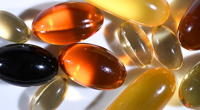 Close up of various Fat Soluble Vitamins in Capsule Form