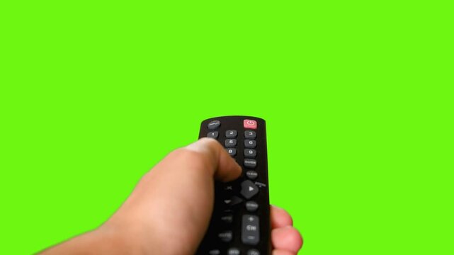 remote control in hand green screen background