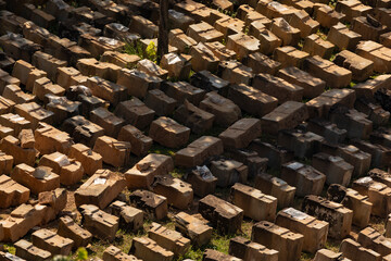 Various architectural and archaeological pieces and remains, labeled, awaiting relocation and reconstruction near the Phnom Bakheng temple, Cambodia