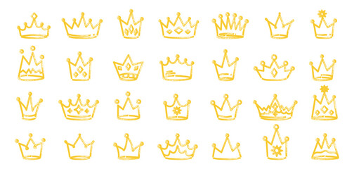 Hand drawn marker crown set in golden yellow color. Childlike doodle crowns with marker texture and expressive strokes. Royal crown icons drawn in marker sketch style. Vector illustration isolated. © IRYNA