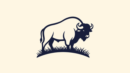 Obraz premium Majestic Bison Standing Proudly in a Field of Grass.