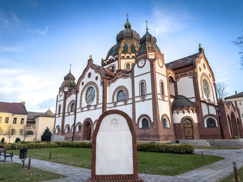 Subotica Synagogue viewed from a garden setting, featuring Art Nouveau design. Also known as Jakab and Komor Synagogue, it is a symbol of the Central European judaism and a landmark of Subotica.