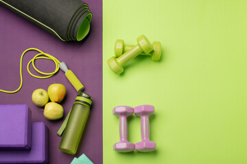 Green and purple fitness yoga background with accessories and free space for text