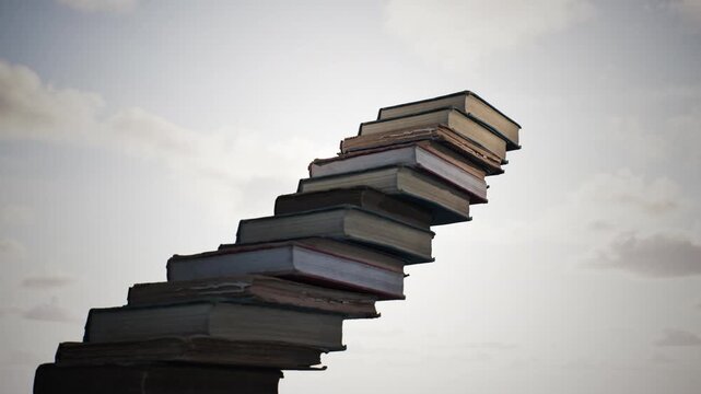 Concept idea stack of books on sky sun set dawn beautiful background. 3D animation. 4K.