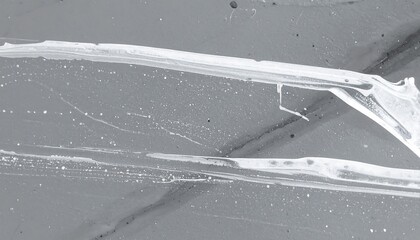 Swaths of white paint on gray