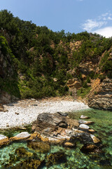 A landscape with the coast and mountains