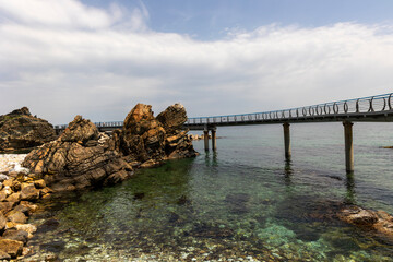 rocky coast and bridge