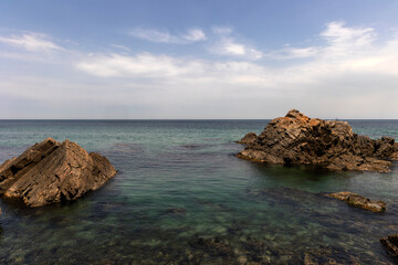 rocks on the beach and cloud