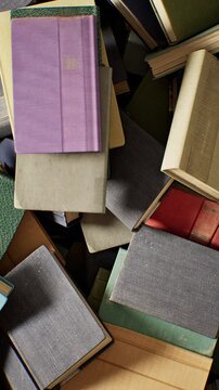Closeup stack of books. 3D animation. 4K. Vertical.	
