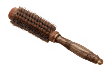 Wooden round styling hairbrush with natural boar bristles, a vintage grooming tool for healthy hairdressing