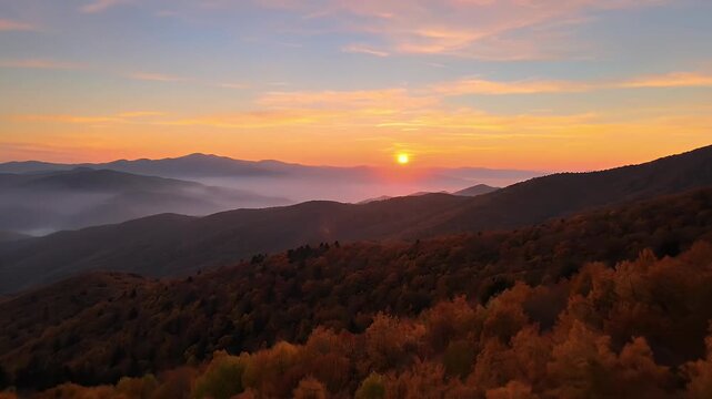 Breathtaking sunrise over rolling hills and misty valleys showcasing vibrant autumn foliage and a golden hour glow perfect for travel nature and landscape design projects