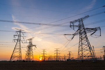 The pylons are in the evening, Substation in the evening, High voltage substation and beautiful sunset glow