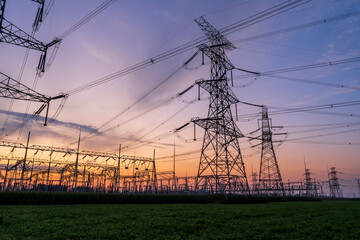 The pylons are in the evening, Substation in the evening, High voltage substation and beautiful sunset glow