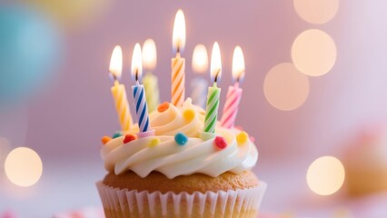 A cupcake with colorful candles lit on a pastel background with bokeh lights.