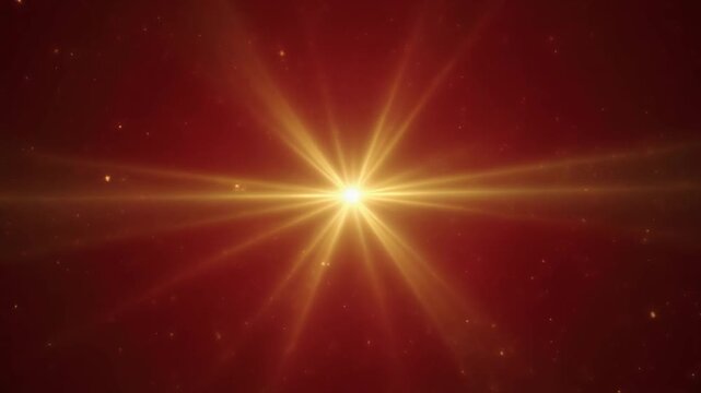 A bright, golden starburst or explosion emanating light and energy against a dark, textured red background with subtle bokeh effects and floating particles
