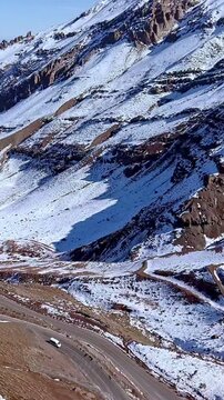 Scenic road at Andes Mountains with snow, near Santiago