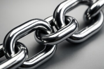 Obraz premium Interlinked: a macro shot of a sturdy metallic chain, the links gleaming with a mirror-like finish