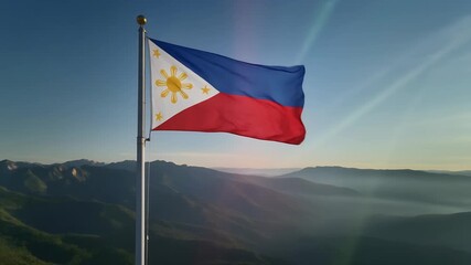Philippine flag waving proudly on mountain peak at sunrise