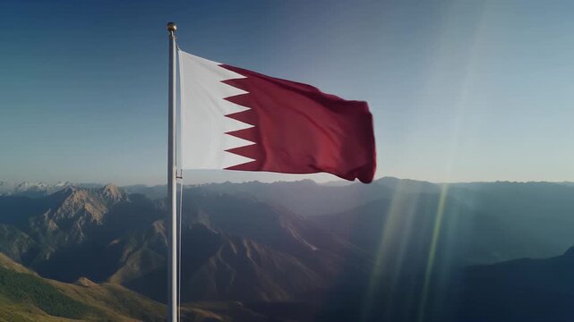 Qatar flag waving on mountain peak with breathtaking view