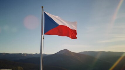 The Czech Republic flag waving in the wind with a beautiful mountain landscape