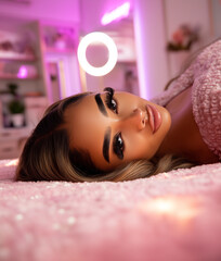 Relaxed Glamorous Woman Lying on Pink Fur Beauty Lifestyle Soft Glam Portrait