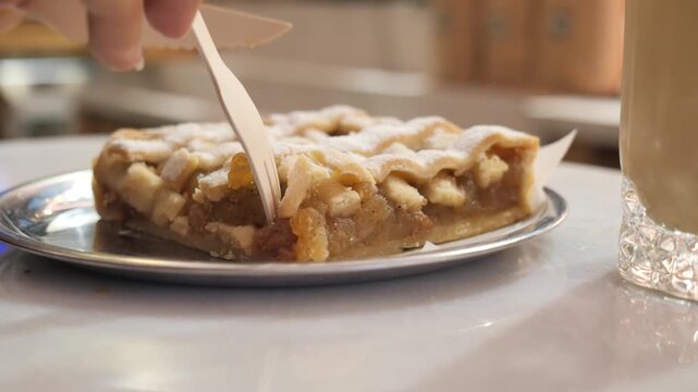 Enjoying apple pie in a cafe in the afternoon