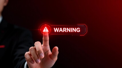 Hand pressing warning button