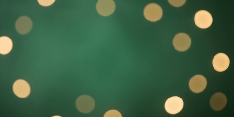 Abstract light spots create a beautiful bokeh on a green background for festive concepts
