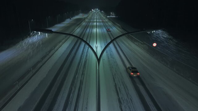 Night highway crossing, Highspeed night journey with contrasting traffic under frosty sky and greenish lamps