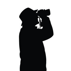 Person looking through binoculars silhouette vector © Ishara sandeepa