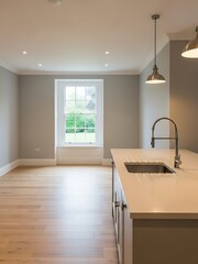 Sophisticated kitchen showcasing a pristine modern interior and natural light
