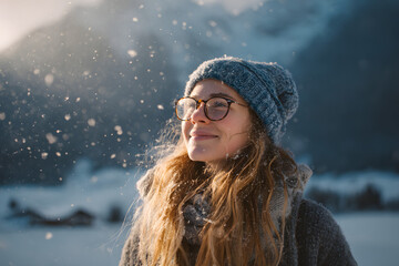 Smiling Woman in Winter Landscape Wearing Knit Hat and Glasses, Cold Weather Lifestyle Portrait