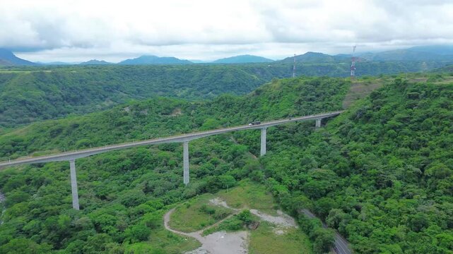 Aerial footage captures the Gualanday Viaduct rising over the valley near Ibagu&eacute;, an impressive modern bridge surrounded by lush Colombian landscapes.