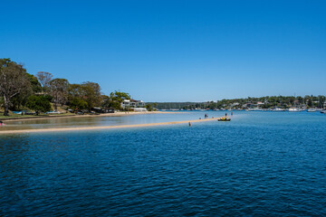 Photo taken in December 2025 at Gunnamatta Bay Baths, Sydney. Gunnamatta Park Tidal Baths are large netted swimming baths with a sandy beach, where people enjoy swimming and leisure by the water.