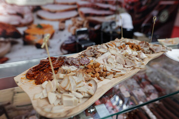 Various Romanian traditional smoked meat cuts for on display to be tried