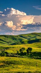 Obraz premium Rolling green hills under a dramatic sky with fluffy white clouds