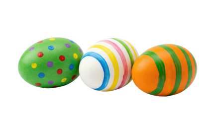 Three decorated easter eggs with green spots, multicolored stripes, and orange stripes isolated on a neutral background with png background