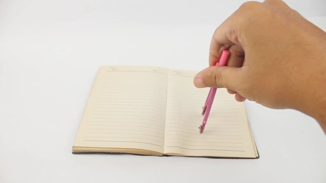 hand holding compass school drawing on book