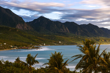 Amazing silky bay seawater,verdant coastal hills,blue  sky, beautiful clouds form a dreamy scenery IN Shanyuan ( Sugihara )  Bay,Beinan Township,Taitung County,Taiwan For branding,screensaver,website 