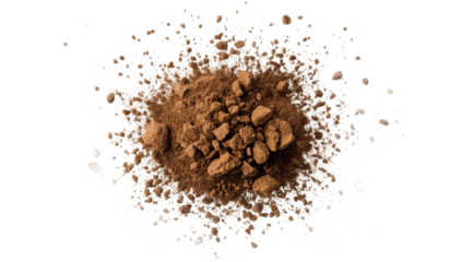 Pile of brown powder, likely cocoa or coffee grounds, scattered on a white background