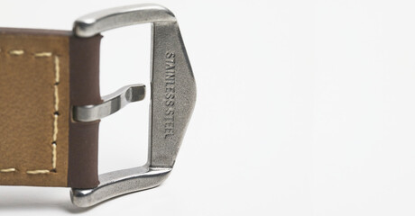 Close up of stainless steel engraving on a watch buckle