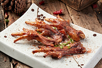 Charcoal-grilled raw chicken feet