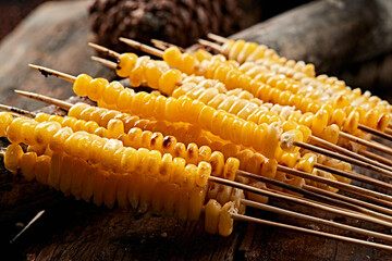Charcoal-grilled corn kernel skewers