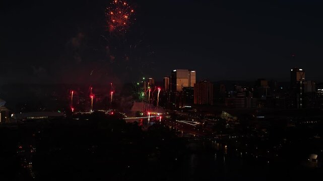 Adelaide City, South Australia &ndash; Aerial Drone View of New Year&rsquo;s Eve Celebration with Night Skyline, Riverbank Precinct, Festival Lights, Urban Cityscape and Fireworks Display Along River Torrens