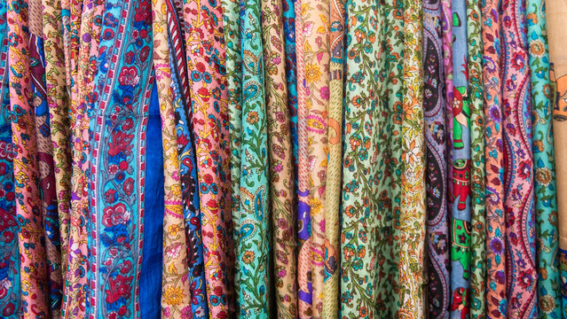 seamless close up background of colorful silk asian scarf  fabric in row with floral pattern